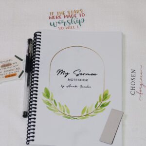 A sermon notebook, a high-quality pen, three assorted Christian stickers, and a magnetic bookmark